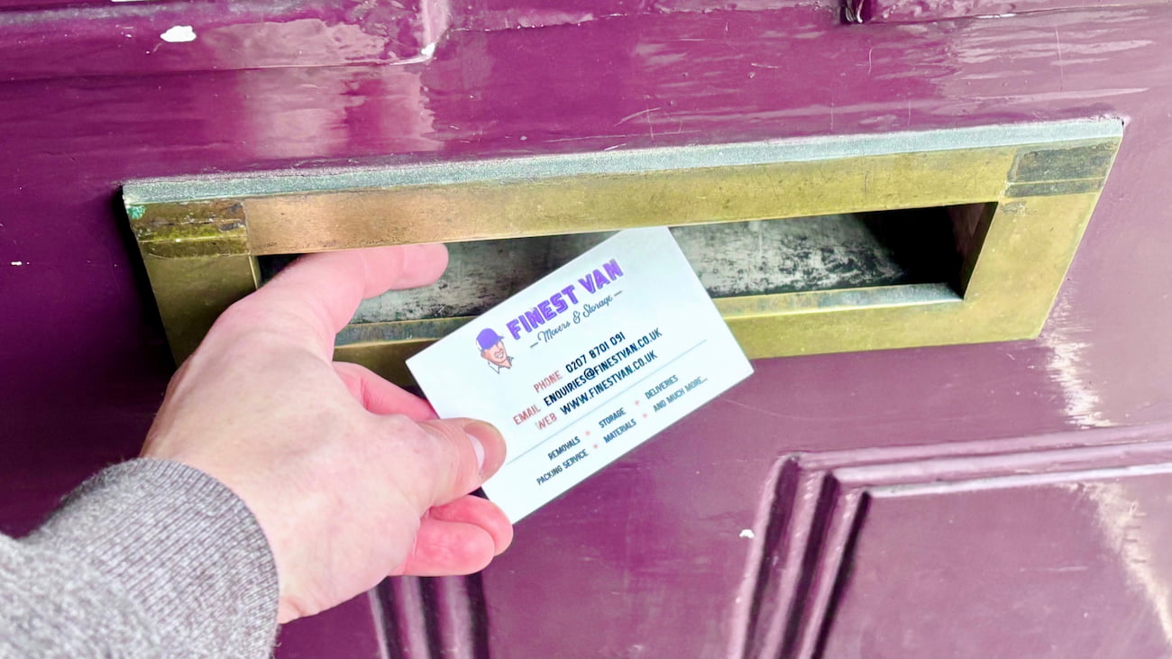 Finest Van moving business card being placed through a letterbox
