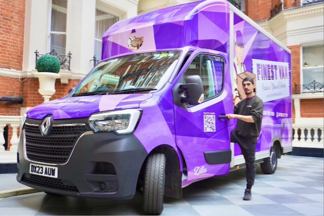 Finest Van Removals Specialist Outside a Property in Kensington Finest Van removals specialist stepping out of a branded moving van in Kensington