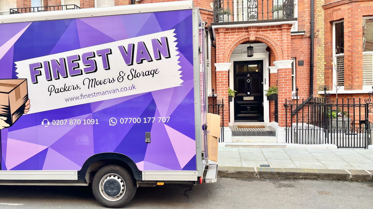 Removal van parked outside a house in London during a move