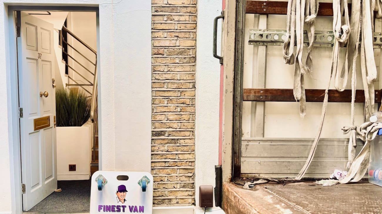 Finest Van removals equipment beside an open truck outside a doorway during a South London house move